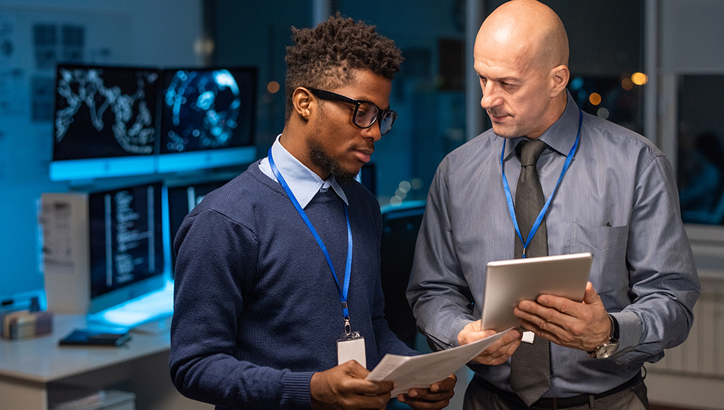 An IT specialist from an IT outsourcing provider shows proof of cybersecurity certifications.