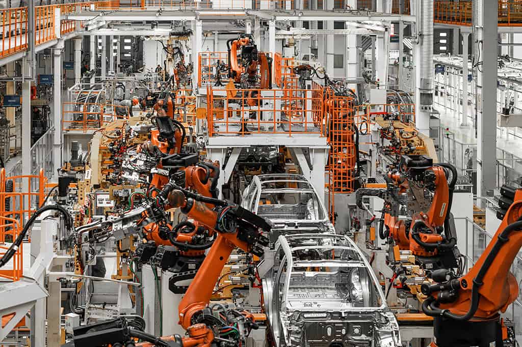 Cars on an assembly line in a vehicle manufacturing plant.