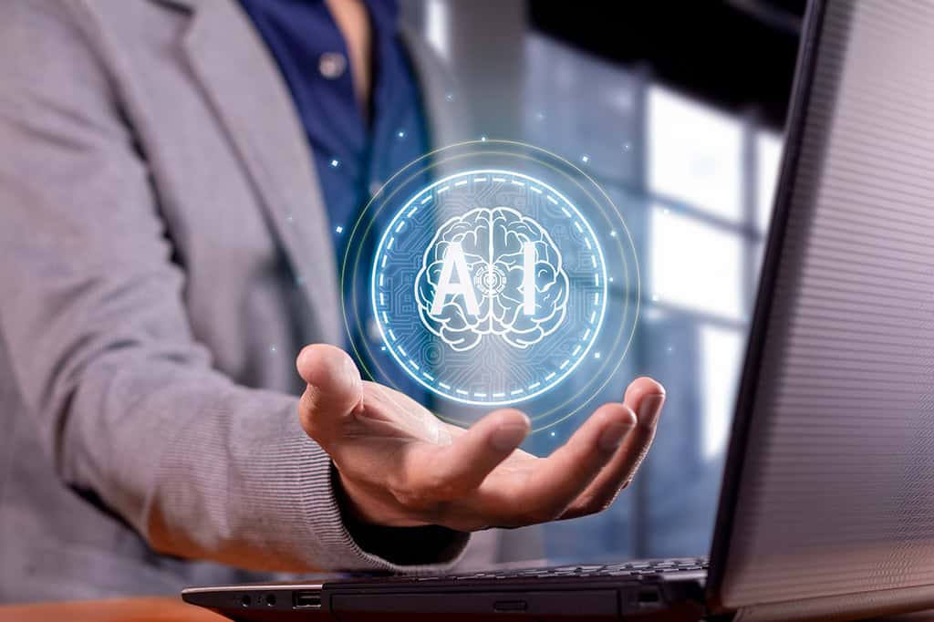 A recruiter or talent acquisition specialist holds an AI-driven system in the palm of his hand