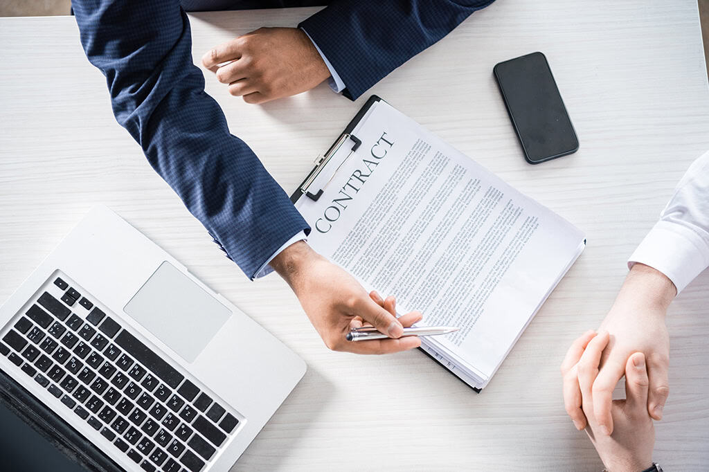 A business owner and a managed IT provider go over a Service-Level Agreement (SLA)