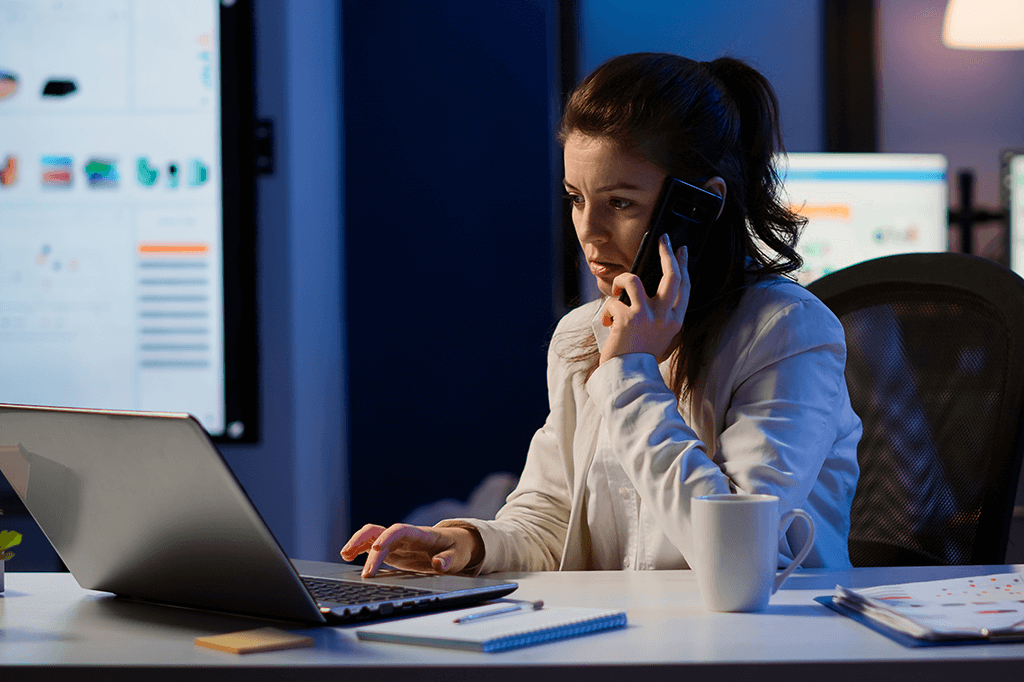 An IT support specialist answers a call in the middle of the night