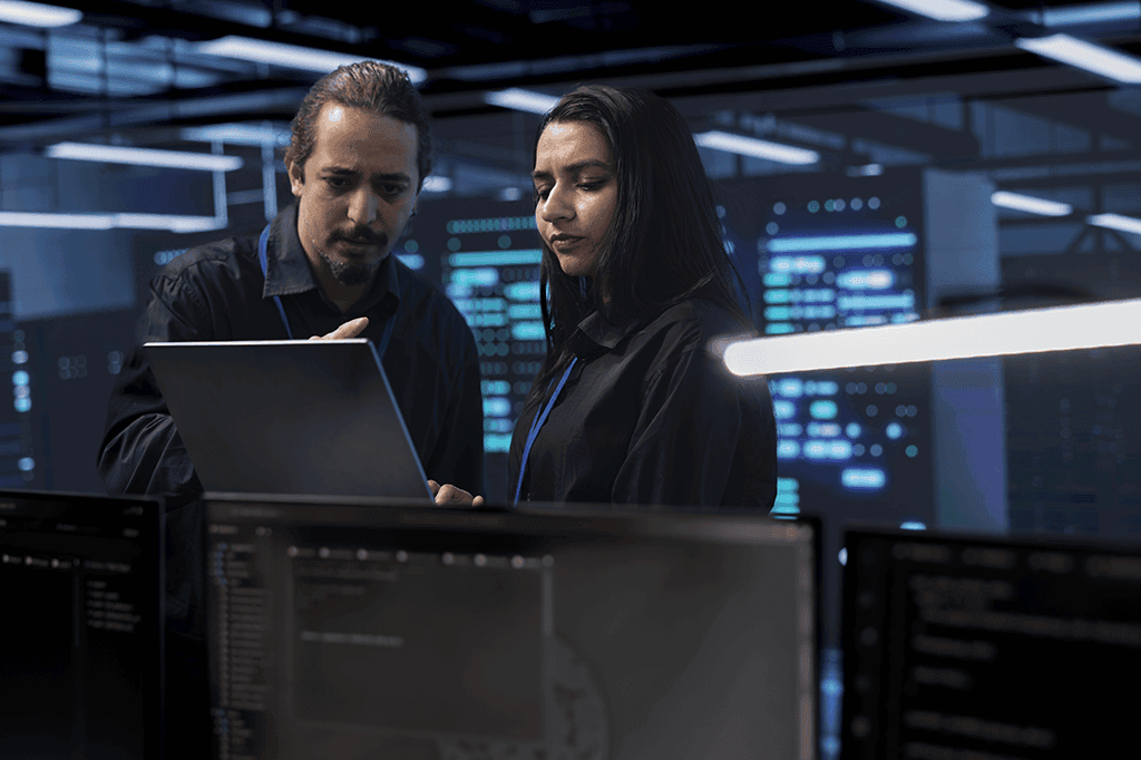 Cybersecurity specialists review a system for intrusion attempts and vunerabilities