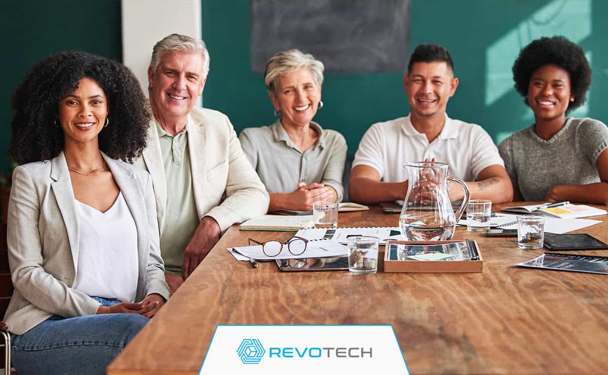 Group of board members in a non profit smiling while meeting