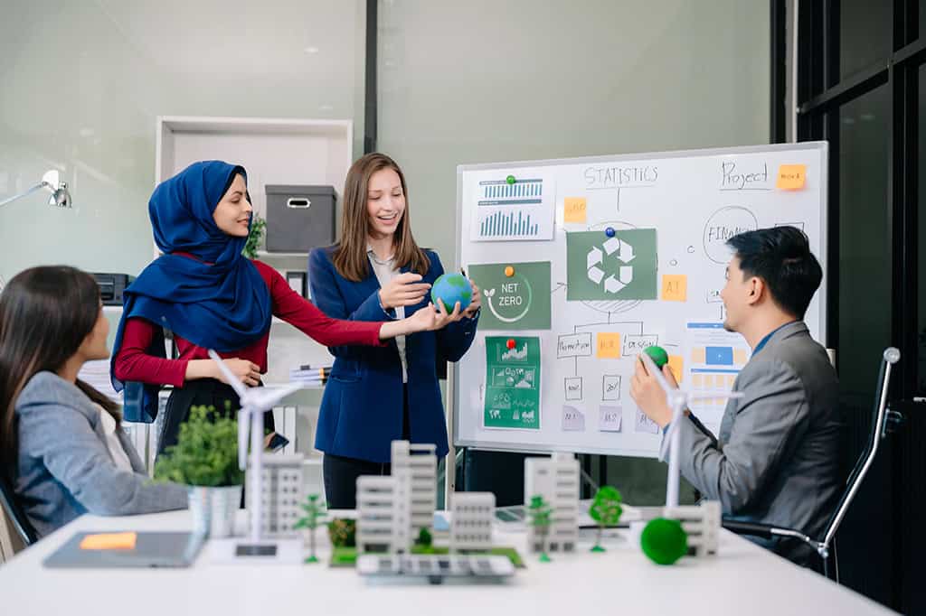 Leaders at a business meet to discuss sustainable business practices. Leaders at a business meet to discuss sustainable business practices.