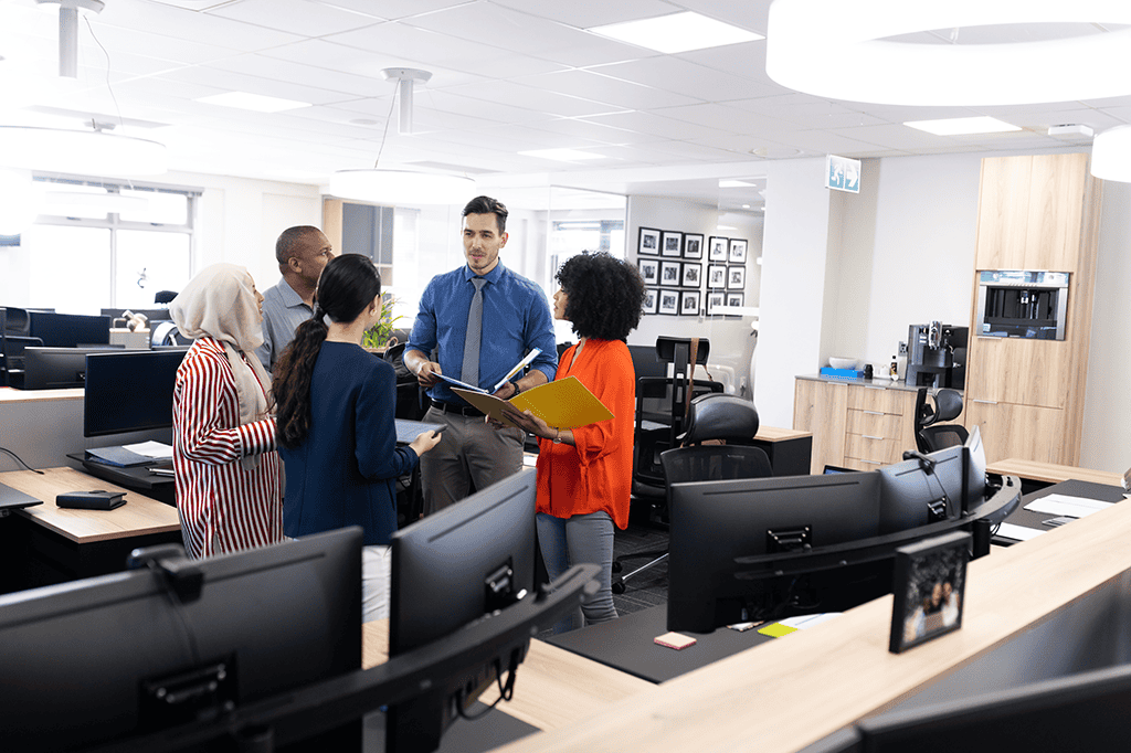 Staff chat during a training workshop for an upcoming help desk rollout.
